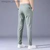 Mäns byxor Summer Men's Casual Pants Thin Soft Soft Elasticity Lace-up midja Solid Color Pocket Applique Korea Gray Black Work Byxor L231129