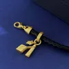 Cuivre en or 18 carats avec bracelet de créateur en cuir noir, portrait gravé classique de mode et bracelet pendentif à talons hauts, de haute qualité
