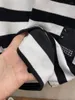 Kvinnor BLOUSES Fashion Mmsix Men's T-shirt 2023 Korean Designer Black White Stripe Sleeve Stitching Shirt Loose Long Tops