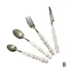 Set di stoviglie Europa Moda Set di posate di perle in acciaio inossidabile Creatività regalo Forchetta Manico da tavola Coltello in ceramica Posate Spo M0R7