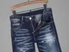 Pantalones vaqueros azules para hombre, lavados con cintura baja y pies pequeños, parche con agujeros de calidad, boutique D2, otoño e invierno