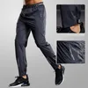 Calças masculinas de secagem rápida calças esportivas homens correndo calças com bolsos zíper treinamento joggings calças esportivas fitness casual sweatpants 231129