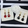 dangle earringsブランドファッションジュエリーfor女性のトップゴールドメッキパーティーブラックレッドクリスタルイヤリングドロップイヤリングヴィンテージラグジュアリーパンクデザイン