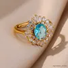 Anillos de banda Anillos de circón de cristal azul romántico para mujer Anillo de flores de acero inoxidable chapado en oro ajustable Regalos de joyería de boda de lujo R231130