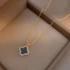 Ontwerper van Clover ketting zwart -wit omkeerbare klaver volledige diamantstijl lichte luxe stijl ketting dames gelukkige klaver ketting