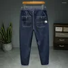 Jeans masculinos 2023 simples cintura elástica marca de moda confortável versátil juventude lápis calças uma peça gota
