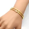 Nuovo arrivo CZ Micro Pave Bracciale rigido a doppia croce da donna per regalo