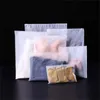 L'emballage translucide givré de vêtements de CPE met en sac des poches réutilisables de tirette de plastique de stockage de vêtements d'EVA pour l'expédition de ménage de chaussette de sous-vêtements de vêtements à la maison