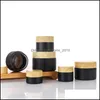 Bouteilles d'emballage Pot de crème en verre givré noir avec couvercle en grain de bois bouteille cosmétique boîte à côté droit pour lotions cosmétiques gommage corporel ot7vo