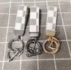 Presbyopia Print Car Car Caychain Сумка для подвесной шарм -ювелирные украшения держатель Keyring для мужчин Подарок мода кожа кожа цветочные сетки Дизайнер металлический сети аксессуары цепочки