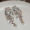 Boucles d'oreilles pendantes TIOWIOS 2023 S925 argent aiguille en forme de U grappe brillante pièce longue gland Premium bijoux cadeau pour les femmes