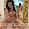 2023 Rose Gold Ball Gown Quinceanera Dresses Bridal Gowns Sparkly Sequined Lace Crystal Beads Illusion Open Back Sequins Half Sleeves Sweet 16 Dress Sweetheart