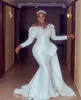 Arabic Aso Ebi Ivory Mermaid Wedding Dresses peplum Lace Pearls Beaded Crystals Sexy long sleeve Bridal Gowns plus size