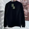 Sudaderas con capucha para mujer Sudaderas diseñador r sudadera con capucha para hombres y mujeres moda nueva letra de principios de primavera marea flocado estampado colisión color corto cultivo algodón manga larga AYEE