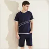 Ropa de dormir para hombre, verano 2023, de talla grande, dos piezas, conjuntos de pijama informales para hombre, traje de algodón Modal, cuello redondo, camiseta, medio pantalón