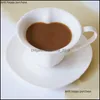 マグカップヨーロッパスタイルの陶器の派手なハートシェーディングコーヒーカップとソーサーセットピュアホワイトコンマティークリエイティブアチェンセンシルドロップデリバリーG dhukf