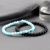 Strand 2pcs/conjunto Black Lava Stone Bracelet Men de 6 mm de contas rachadas naturais Braceelets Stretch Bangles Women Yoga Healing Jóias