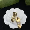 Boucles d'oreilles breloque coeur tête de lion. Bronze vieilli plaqué or. Boucles d'oreilles de créateurs de luxe pour femmes. Cadeaux de noces pour la noce aretes bijoux de créateurs