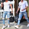 Jeans da uomo elasticizzati strappati strappati alla moda Pantaloni alla caviglia con cerniera skinny per uomo