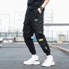 Pantaloni da uomo Tasche laterali da uomo Cargo Harem 2023 Nastri Pantaloni da jogging maschili hip-hop neri Pantaloni Moda Streetwear