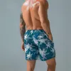 Shorts masculinos praia seca rápida Trenks estampados esportes jovens e lazer de cinco pontos da moda Big Pants 2023