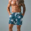 Shorts masculinos praia seca rápida Trenks estampados esportes jovens e lazer de cinco pontos da moda Big Pants 2023