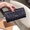 Designer de marca carteira cartão pacote mudança bolsa moeda bolsas bolsa de pele de carneiro saco plissado mulheres carteiras beleza versátil moda couro simples venda direta da fábrica