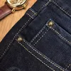 Erkekler Kot Tasarımcı Moda Tasarımcısı Kot Stil Sıcak Baskı Deliği Boya İnce Streç küçük ayaklar denim Q2if