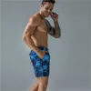 Shorts masculinos praia seca rápida Trenks estampados esportes jovens e lazer de cinco pontos da moda Big Pants 2023