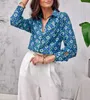 Kvinnors blusar Europeiska och amerikanska högkvalitativa färgglada blommuttryck Långärmad skjortor Knapp Lös avslappnad kvinnor Vintage Tee