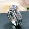 Bröllopsringar huitan eleganta kvinnor lyx inlagd oval cz mode cross design finger engagemang parti trendiga smycken