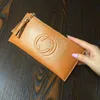 2023 Bags Outlet Online sale simple ultra-thin wallet tassel women's long zipper soft cowhide handbag leather clip new style