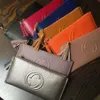 Cartera de cuero ultrafina simple con borla para mujer, Cremallera larga, bolso de cuero vacuno suave, clip de cuero, nuevo estilo