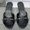 CAGOLE SANDAL Slippers cagole heeled sandals in black Arena lambskin catwalk models Fashionable metal slipper Fashion bloggers and celebrities with same sandale