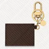 M69003 Kirigami Pouch Bag Charm Soptor de llave diseñador de monedas de monedas para mujer Mini billetera Case de cubierta Anillo de llavero Pochette D268G