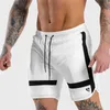 Pantalones cortos para hombres NUEVOS Pantalones deportivos para hombre Gimnasios de verano Entrenamiento para hombre Malla transpirable Ropa deportiva de secado rápido Jogger Beach Brand Pantalones cortos Y2302