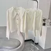 Kvinnors stickor 2023 Spring Solid Color Sticke Wear Peter Collar Wool Hollow Sticking Sweater Coat Cardgians for Girls