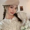 Kvinnors polos student vit docka krage långärmad skjorta hösten 2023 kvinnlig koreansk version lös och tunn mångsidig toppmode