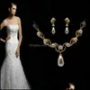 Orecchini Collana Placcato oro 18 carati Set di gioielli da sposa con perle color crema e strass di cristallo 1834 T2 Drop Delivery Dh4Iy