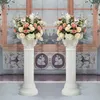 装飾的な花の周りのローマの柱直立柱アーチ植木鉢ヨーロッパ道路主要な結婚式のパーティーシーンのプラスチックデコレーション
