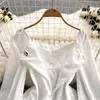 Vestidos casuais zcwxm primavera de mola de pescoço branco vestido papagaio pu parafuso de manga longa e chique de gancho chique mini praia slim