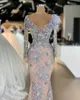 2023 Sexy Arabic Evening Dresses Wear for Women Silver Gray V Neck Mermaid Long Sleeves Lace Appliques Feather Crystal Beaded 3D Floral Formal Prom Dress Party Gowns