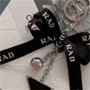 Designer Key Chains Ladies Ribbon Key Ring Bag Pendant Car Keychains Fashion Letter Keyrings Casual Bags Pendant High Quality