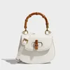 2023 Purses Clearance Outlet Online Sale Niche design bamboo pink saddle small summer new high texture one shoulder handbag