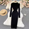 Casual jurken breien met lange mouwen uit holte uit sexy dames maxi jurk elegant chic bodycon mode geribbelde massief zwart gewaad pullover vestidos y2302