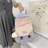 Okul çantaları traveasy Kore yüksek kadın sırt çantası naylon kontrast renkli omuz çantası tiki tarzı genç kız peluş kolye ile gündelik