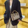 2023 Monederos Liquidación Outlet Venta en línea Nuevo Estampado de moda premium Pequeño cuadrado Versátil Un hombro Crossbody Casual Bolso de mujer