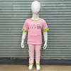 Roupas de roupas felizes para páscoa 18t roupas de roupa de menina com coelho de desenho animado fofo e bordado de carro rosa calça xadrez curta de manga curta quente w230210