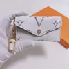 985 Llavero de diseñador de lujo Moda para mujer Mini billetera de cuero genuino de alta calidad para hombre Monedero Color Monederos Titular sin caja