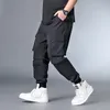 Calças masculinas Hip Hop Streetwear Men Oversize Menor Removable Short Male Jogger Cargo Calça de alta qualidade e Szie 6xl 7xl HX412 Men.